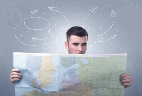 Young man holding map Foto stock