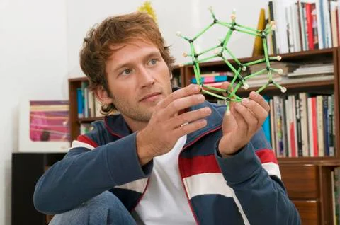Young man holding model Stock Photos