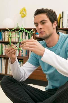 Young man holding model Stock Photos
