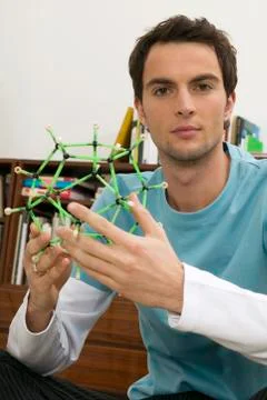 Young man holding model Stock Photos