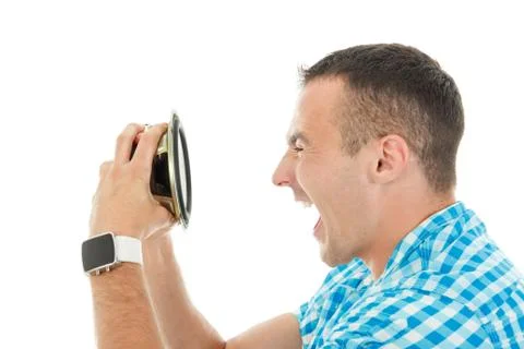 Young man holding object loudspeaker listening to loud music yelling Stock Photos