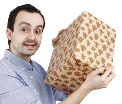 Young man holding a present Stock Photos