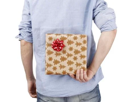 Young man holding a present Stock-Fotos