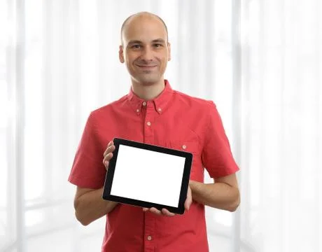 Young man holding a tablet pc Stock-Fotos