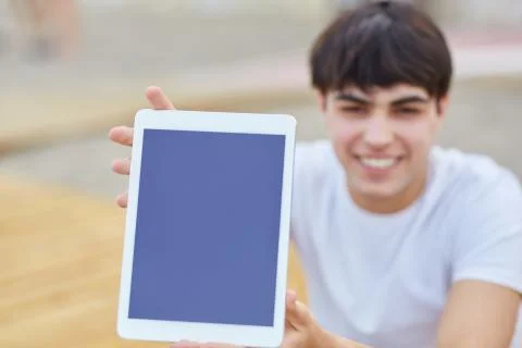 Young man holding tablet Stock Photos