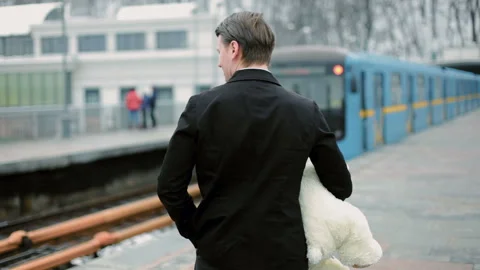 Young man is holding a teddy bear. Stock Footage 117673975