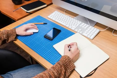 Young man at home using a computer, freelance developer or designer working Stock Photos