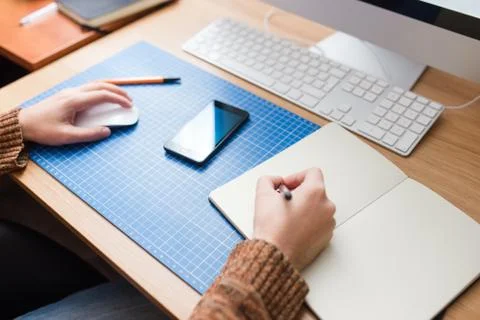 Young man at home using a computer, freelance developer or designer working Stock Photos
