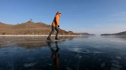 Young Man Ice Skating on Beautiful Baikal Lake, Russia. Stock-Footage 125069341