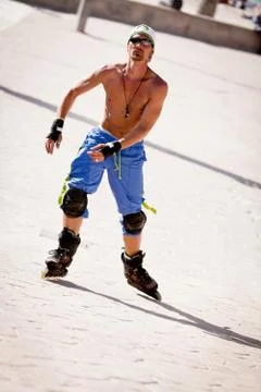 Young man with inline skates in summer outdoor Stock Photos