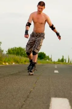 Young man with inline skates in summer Stock Photos