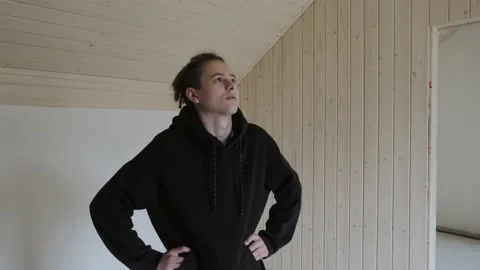 A young man inspects the room during the renovation. Video stock 132171802