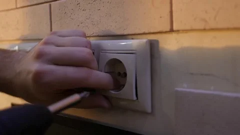 Young man installation of electric outlets drill Stock Footage 84201610