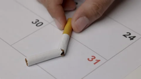 A young man intends to quit smoking on May 31, the World No Tobacco Day. Stock Footage 152766053