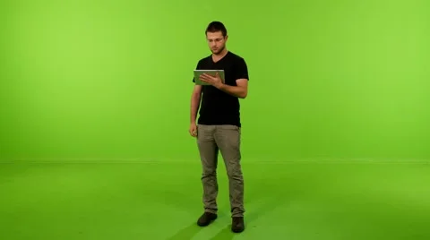 Young man ipad greenscreen 4K 動画素材 63009995