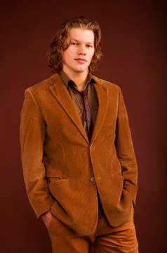 Young man in  jacket  isolated on brown background Stock Photos