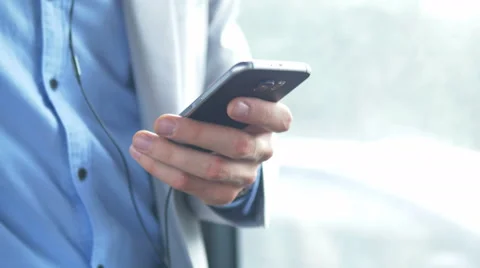 Young man in jacket with a phone Video stock 67105567