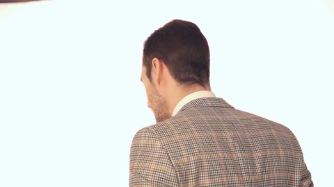 A young man in a jacket smiling at the camera 스톡 동영상 72028765