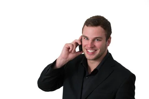 Young man in jacket talking on the phone Stock Photos