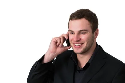 Young man in jacket talking on the phone Stock Photos