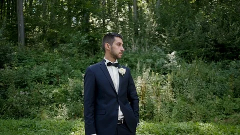 Young man in a jacket waiting for the bride. wedding day Stock-Footage 100990669