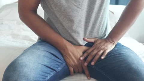 Young man in jeans suffering from intense lower abdominal and groin pain si.. Stock Footage 332471978