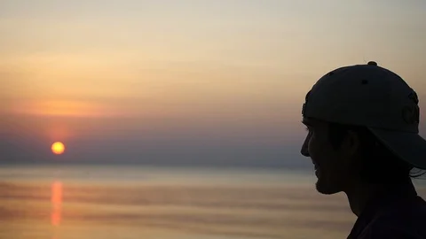 Young man jogging on beach during beautiful sunset, slow motion. 1920x1080 Stock Footage 100660960