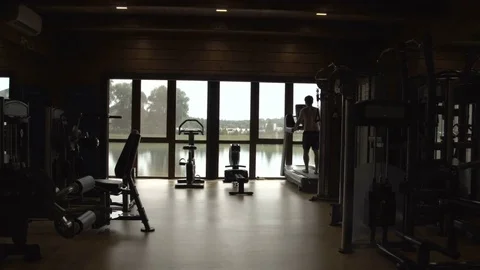 Young man jogging in the gym Stock Footage 78910002