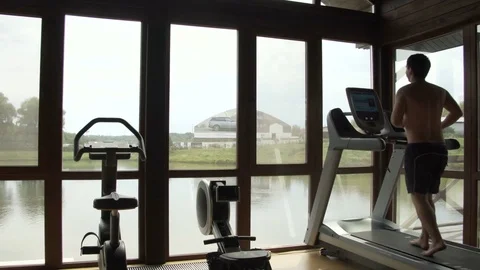 Young man jogging in the gym Stock Footage 78911460