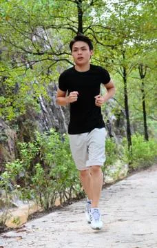 Young man jogging Stock Photos