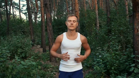Young man Jogging in the woods Stock Footage 95689751