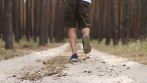 Young man jogging in the woods. Narrow focus. Stock-Footage 150260524