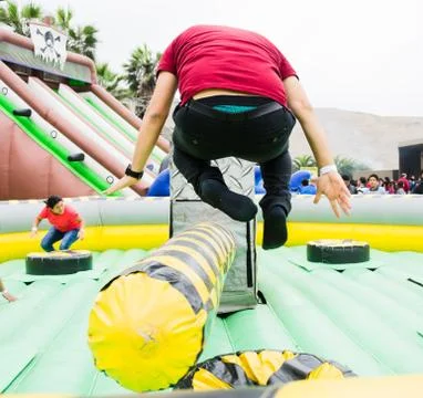 Young man jumping and dodging an obstacle. Stock Photos