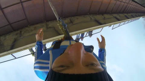 Young man jumping from the bridge facing forward Stock Footage 36552345