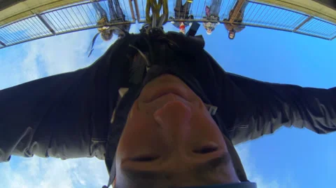 Young man jumping from the bridge, turning Stock Footage 34011656