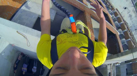 Young man jumping from high-rise closed from fear eyes Stock Footage 38187433
