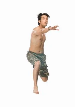 Young man jumping with joy Stock Photos