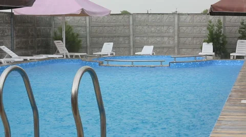 Young man jumping in the pool Video stock 64987957