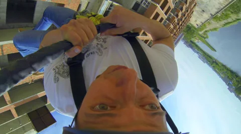 Young man jumping sharply down his eyes bulging with fear Stock Footage 38190302