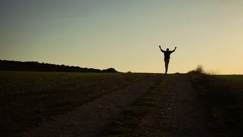Young man jumping at sunset in nature Stock Footage 88965274