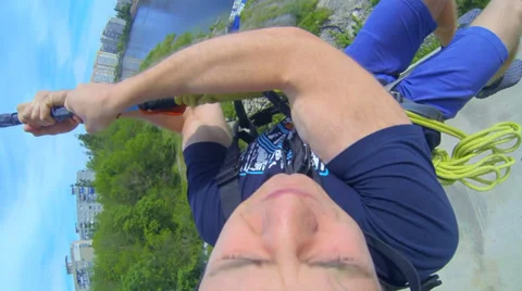 A young man jumping with unfinished floor skyscraper Stock Footage 38187345