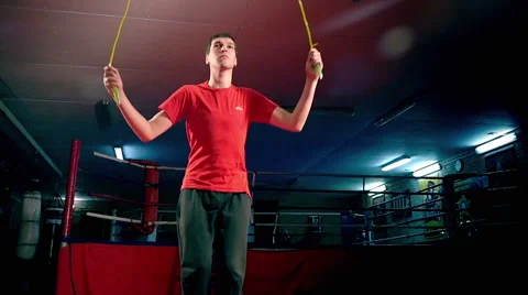 Young man jumps with a jumping rope, slow motion 1 Stock-Footage 65760749