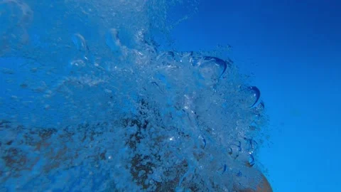 Young man jumps into the pool backwards. Selfie Stock Footage 256154465