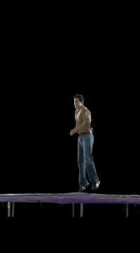Young Man Jumps on Trampoline Stock Footage