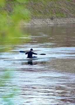 Young man kayaking on river. Stock Photos