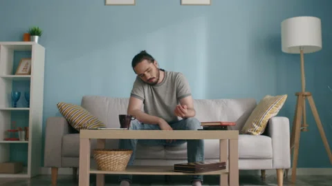 Young Man Kills Time by Throwing Dice Video stock 133374120