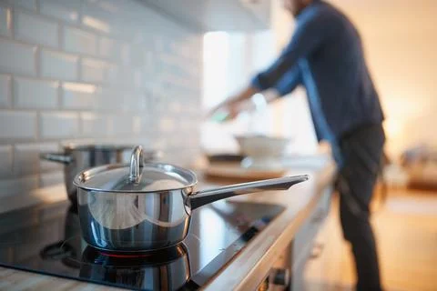 A young man at the kitchen. Kitchen, housework, quarantin, home Stock Photos