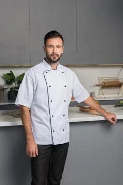 Young man in the kitchen Stock Photos