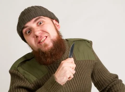 Young man with knife Stock Photos