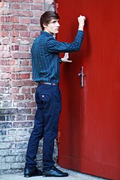 Young man knocking Stock Photos
